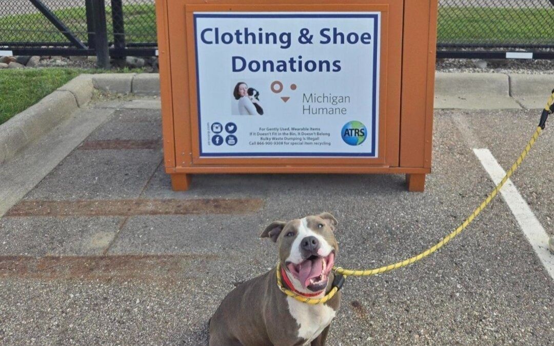 Image of an ATRS bin in Michigan that raises money for Michigan Humane with a cute puppy in front.